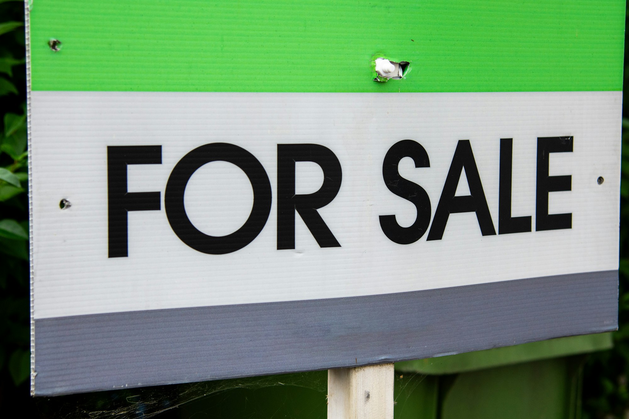 Real estate For Sale sign in front of a home, representing a seller preparing to list their property in British Columbia