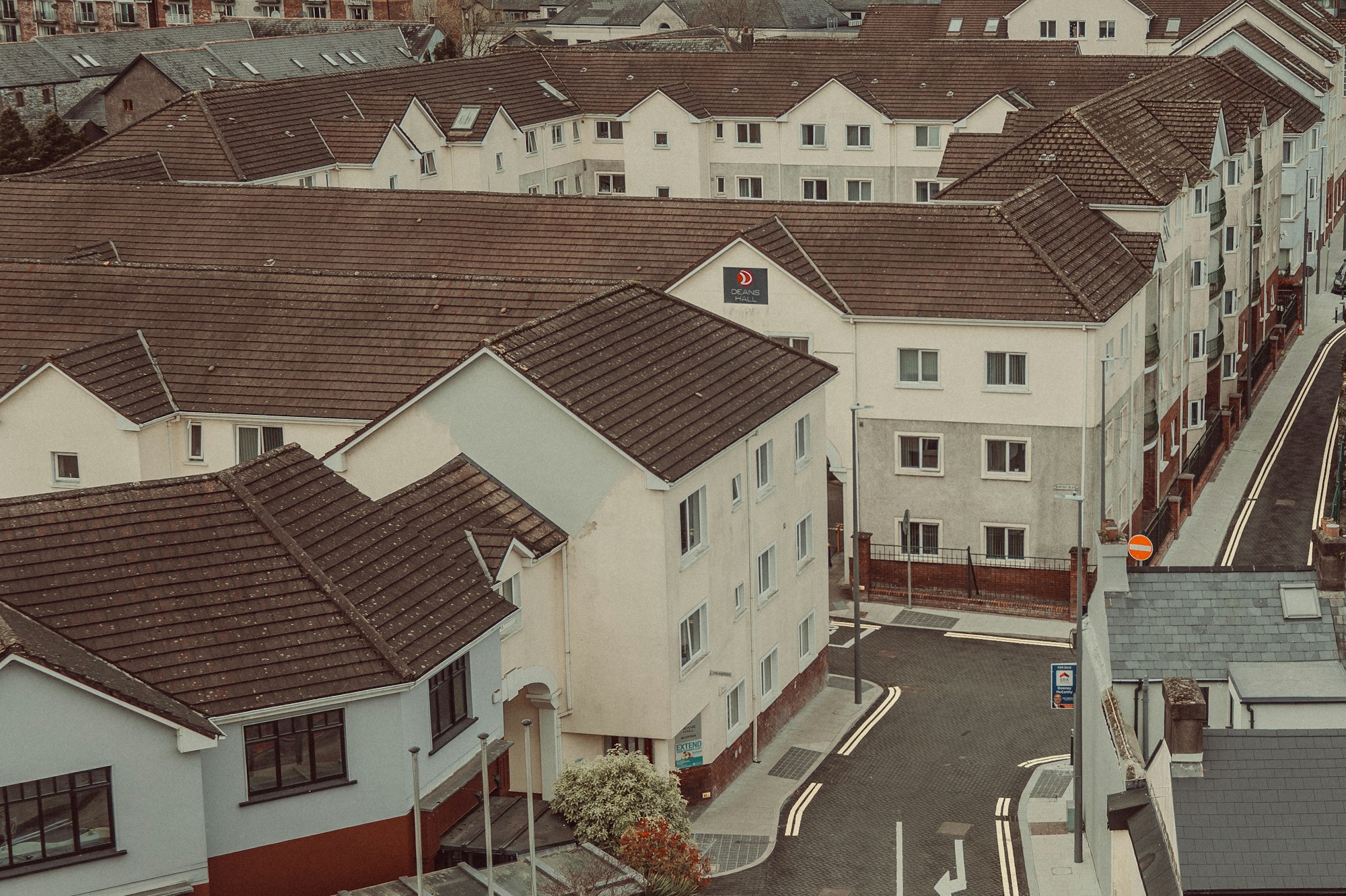 Rows of modern townhouses with brown roofs representing strata property ownership in British Columbia